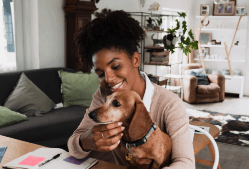 Lady hugging dog - Partnerships DocuPet